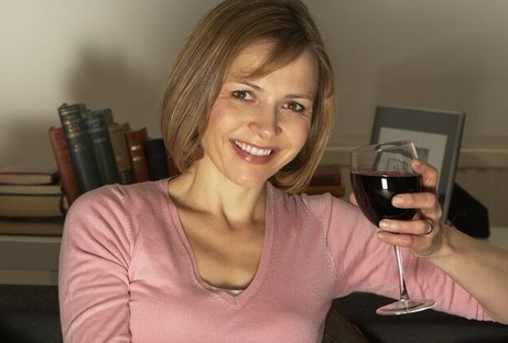 Woman enjoying glass of craft wine