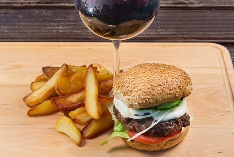 Burger and fries with craft wine